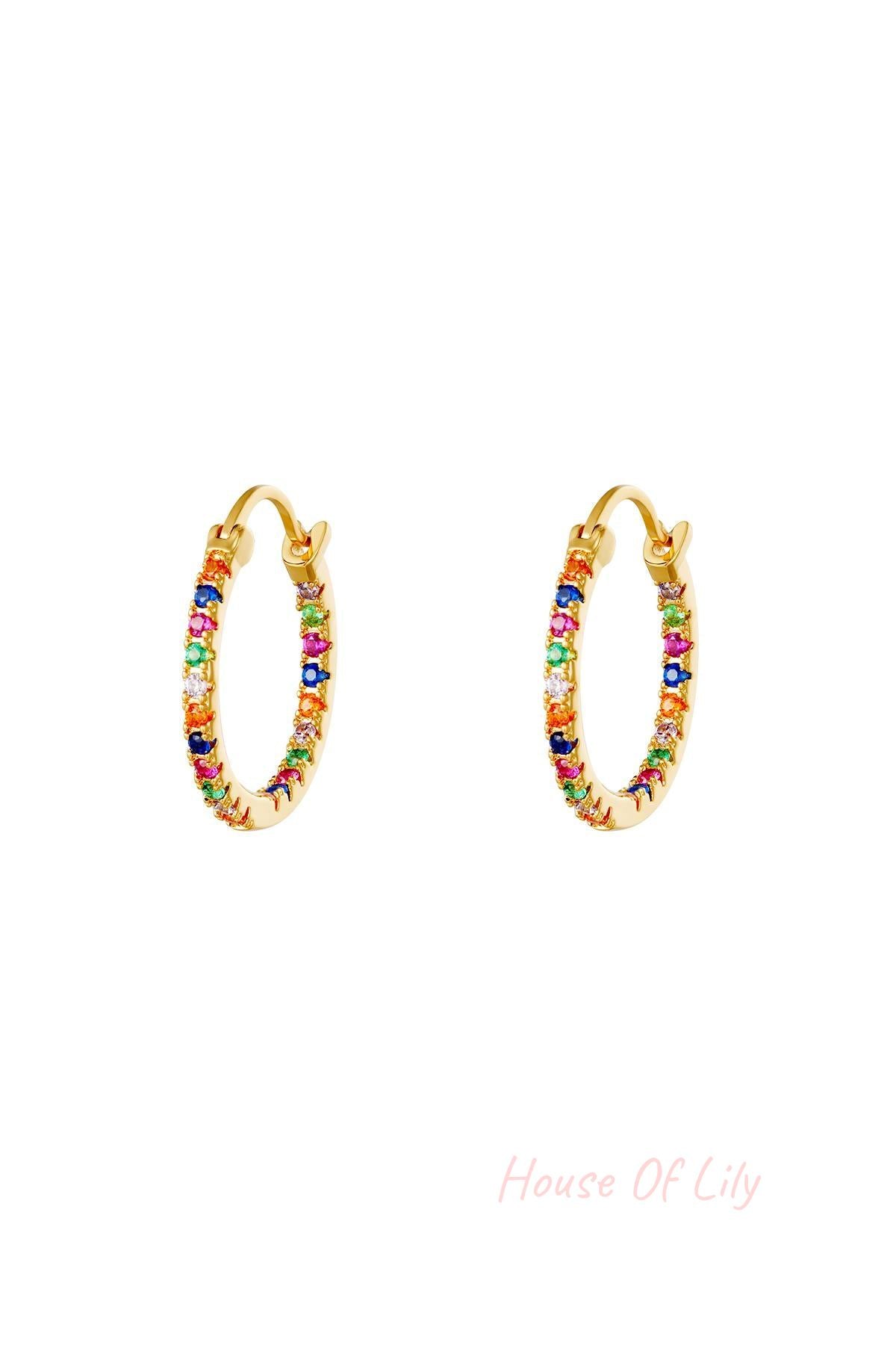 Pair of gold hoop earrings studded with small multicolored stones on white background
