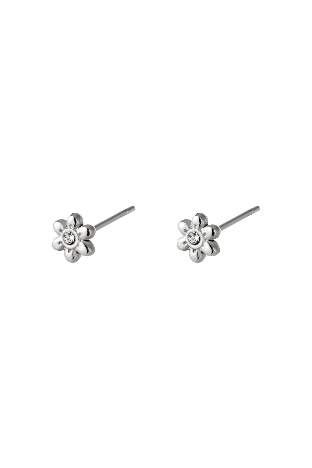 Pair of silver floral mini stud earrings with rhinestone center on white background