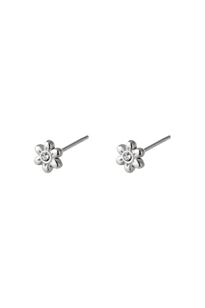 Pair of silver floral mini stud earrings with rhinestone center on white background