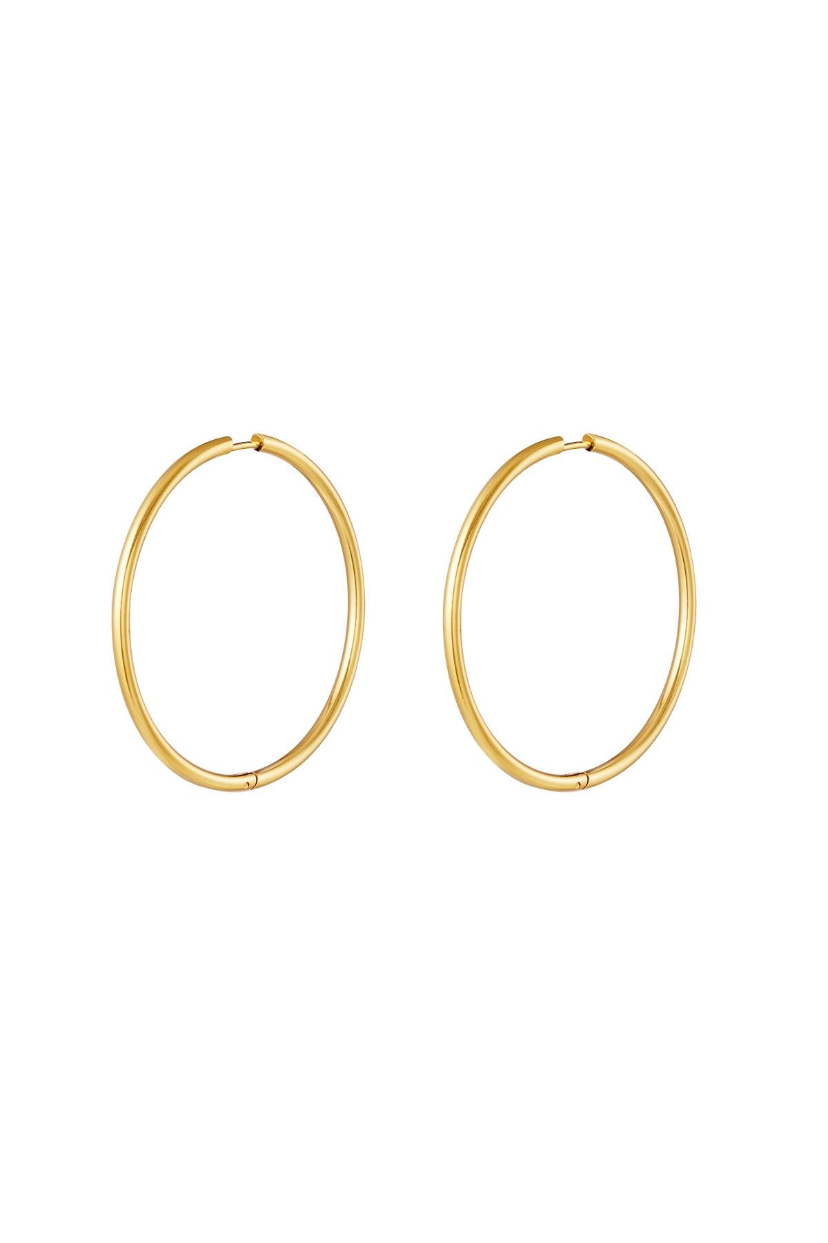 Pair of classic gold hoop earrings with smooth, thin design and secure clasp on white background