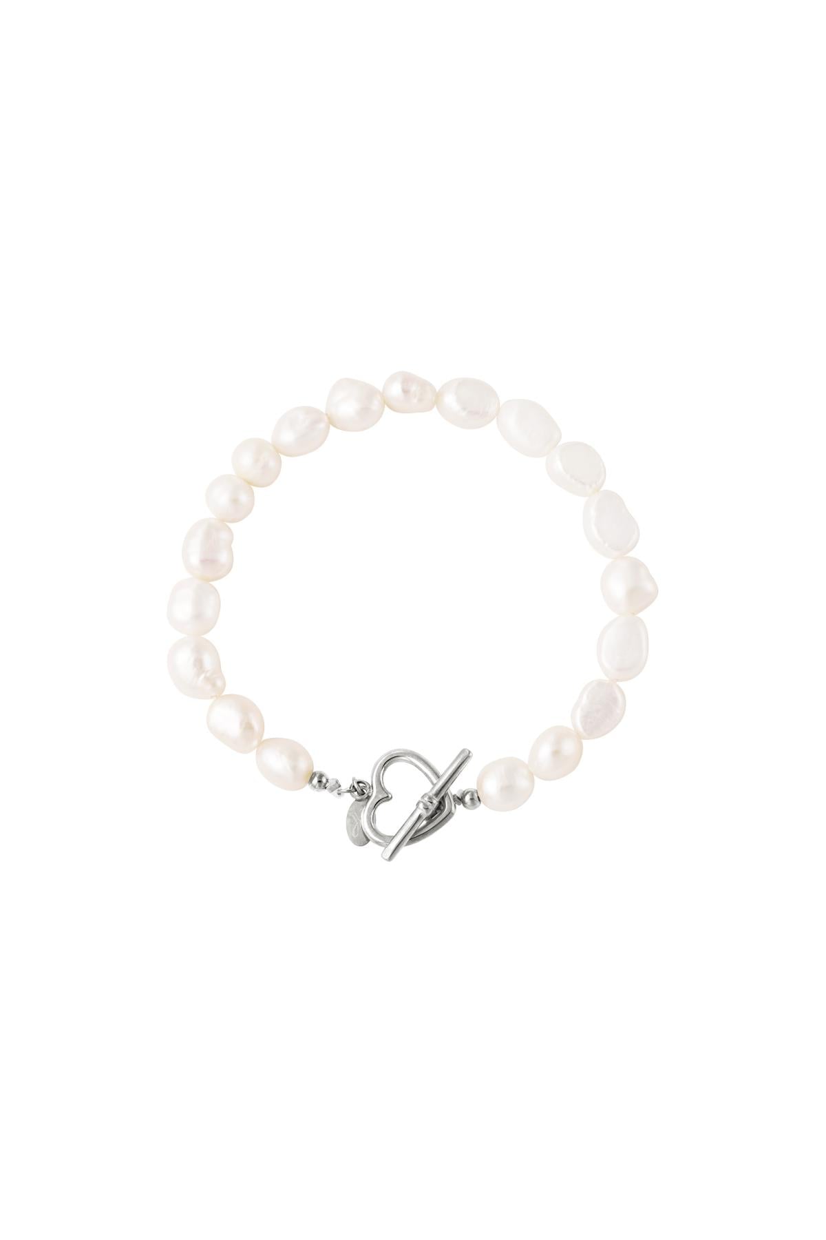 Freshwater pearl bracelet with irregular white pearls and silver heart-shaped toggle clasp on white background, showing variant option.