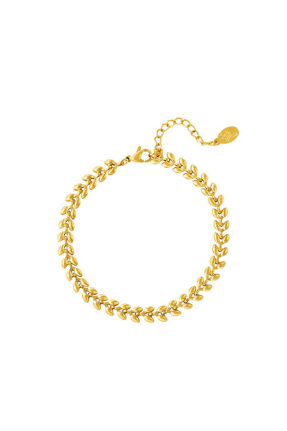 Close-up of gold leaf chain bracelet with lobster clasp and adjustable chain on white background