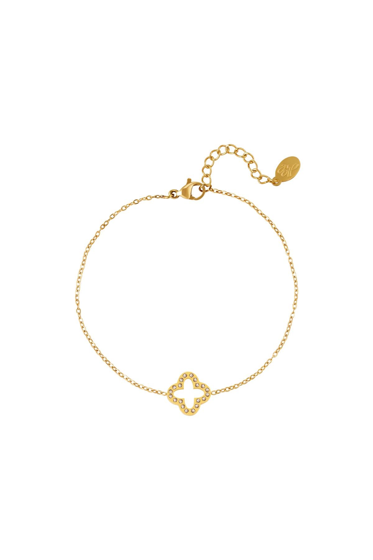 Gold clover charm bracelet featuring sparkling zircon stones and adjustable chain clasp on white background