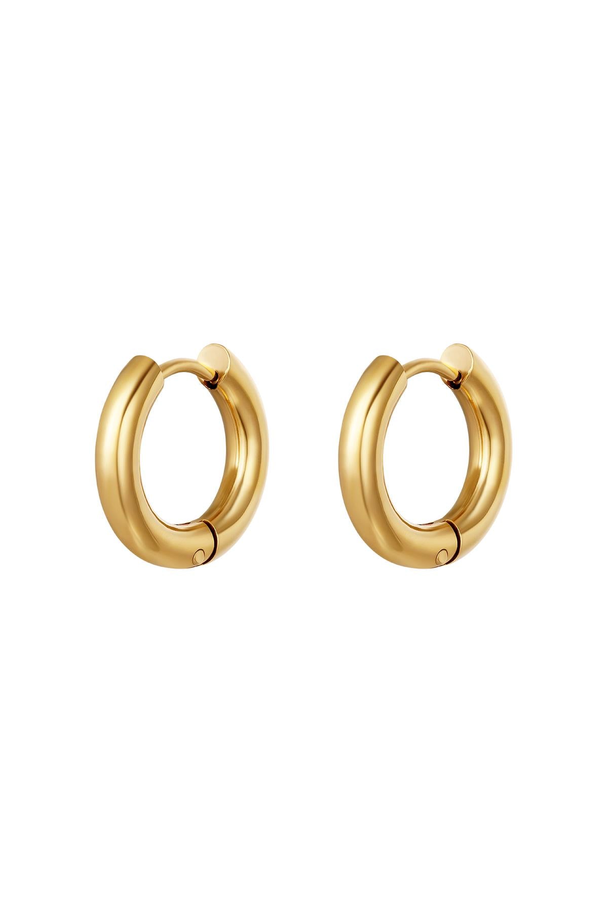 Pair of chunky gold hoop earrings with smooth, polished finish
