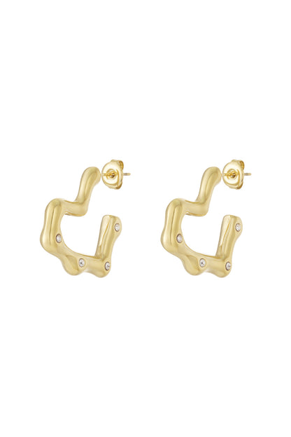 Gold wavy hoop earrings with rhinestone accents on a white background