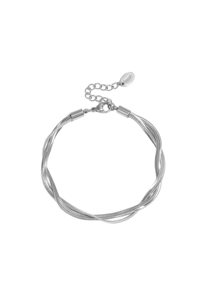 Silver twisted metal chain bracelet with lobster clasp and adjustable extension on white background