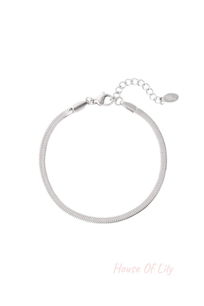 Sleek silver-tone herringbone chain bracelet with lobster clasp and adjustable extension chain on a white background