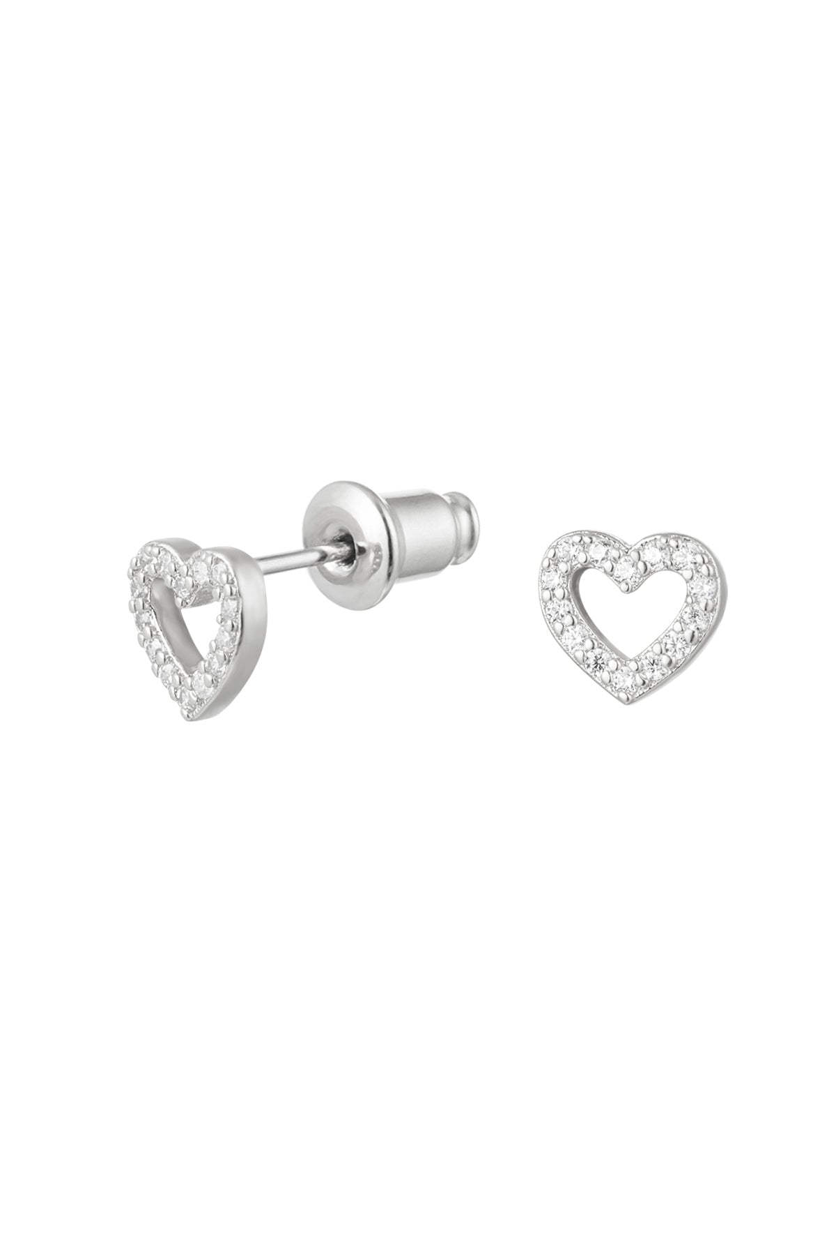 Close-up of silver heart-shaped stud earrings decorated with clear rhinestones on white background