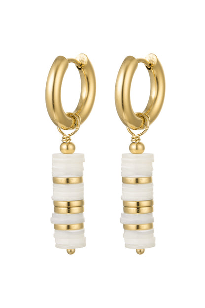 Pair of gold hoop earrings with layered white and gold beaded pendants.