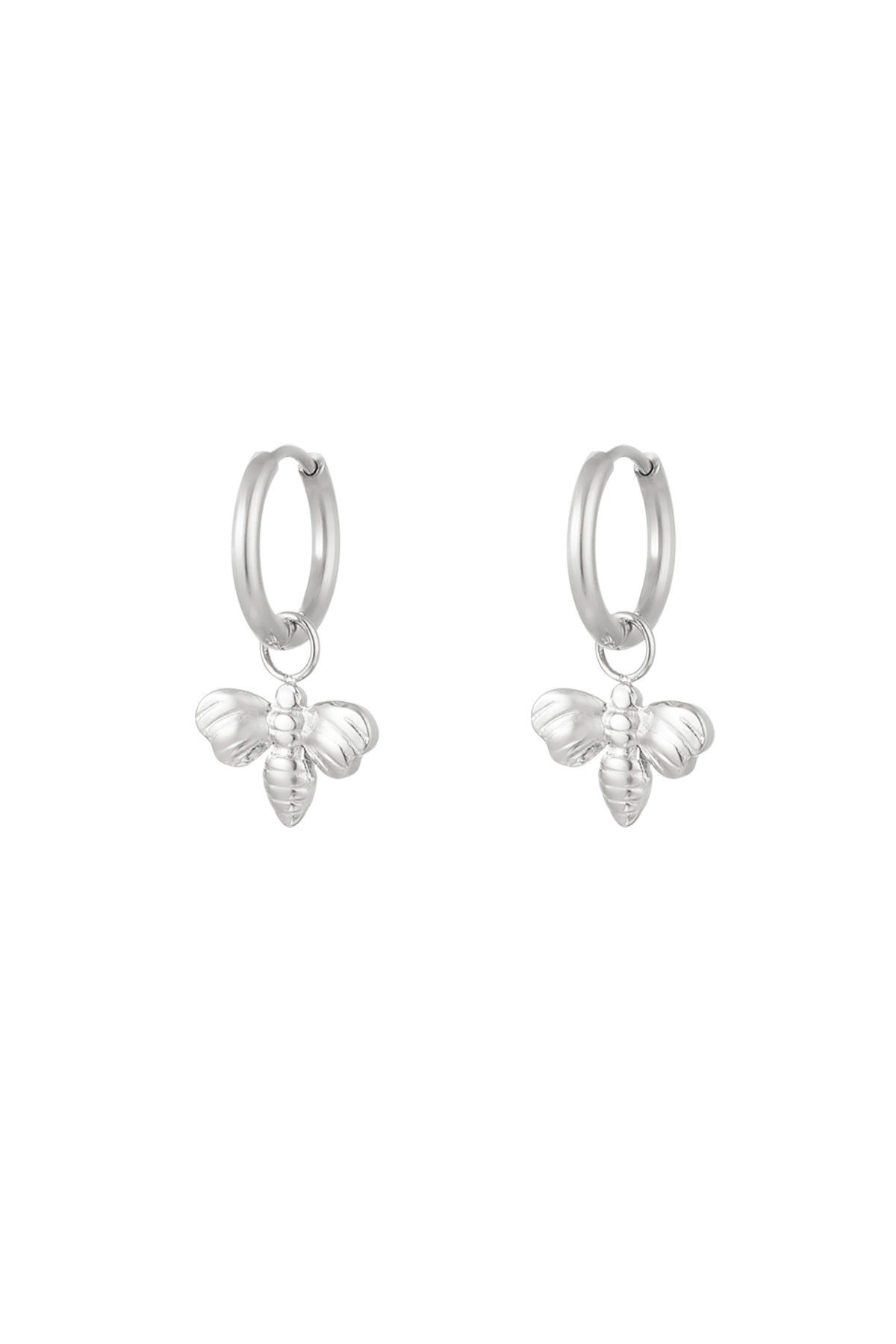 Pair of silver bee charm hoop earrings on white background