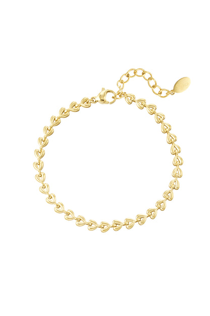 Gold linked heart chain bracelet with lobster clasp and extender on white background