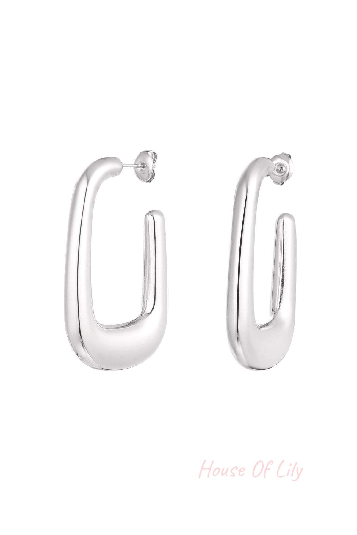 Dreamy Cloud Hoops: Silver-toned, polished U-shaped hoop earrings with a thick, modern, chunky design.