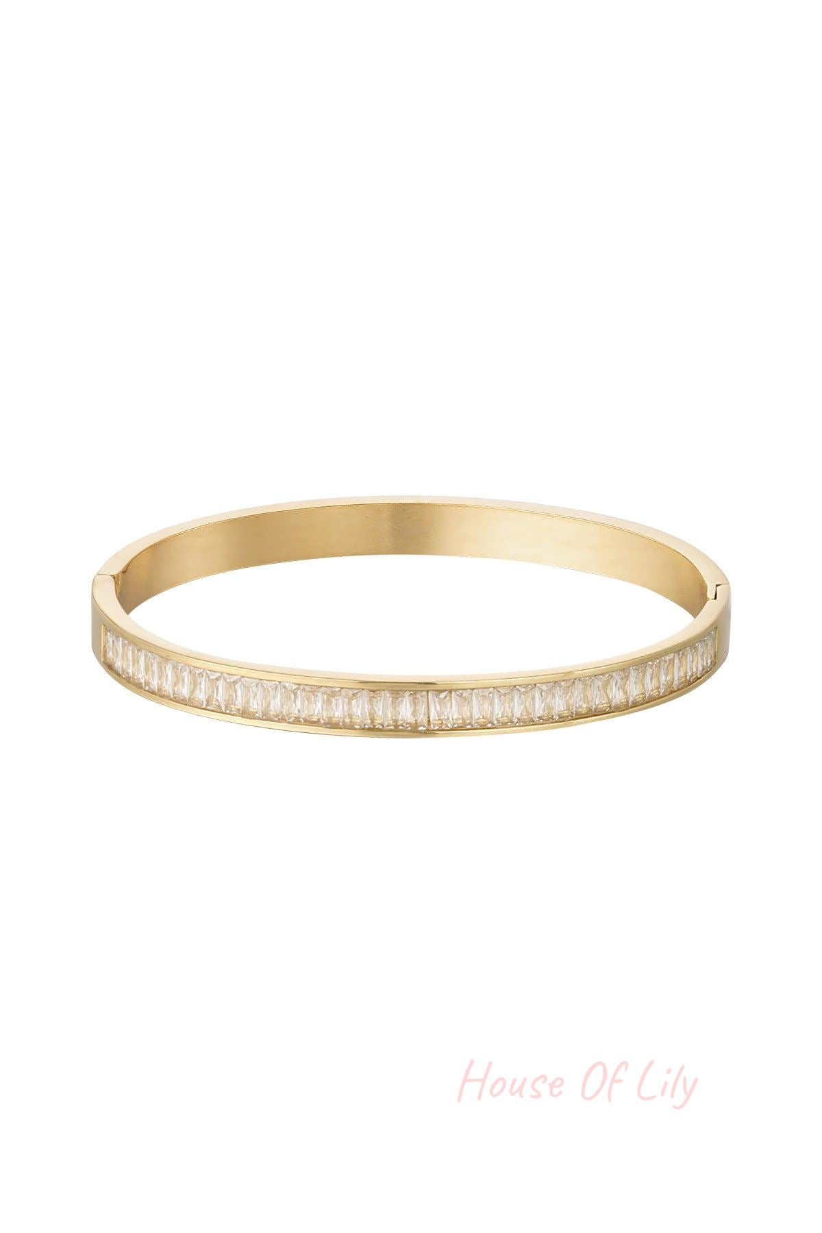 Gold-tone bangle bracelet with sparkling clear square-cut crystal stones displayed on white background