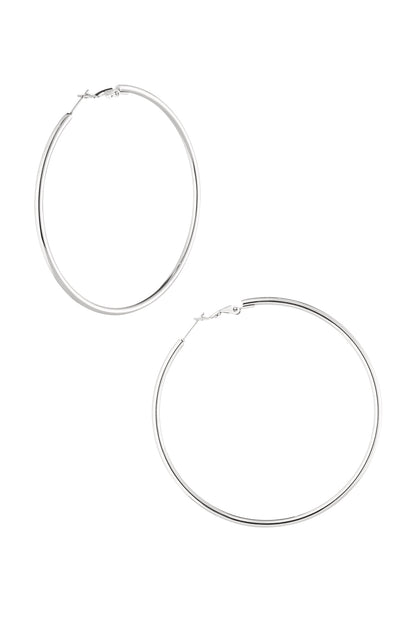 Pair of polished silver hoop earrings with snap latch closure displayed on white background