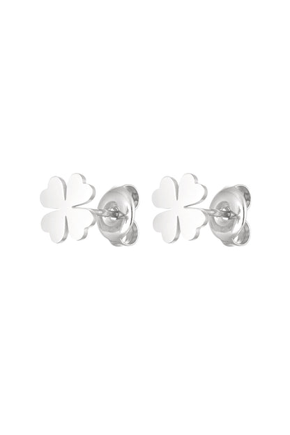 Pair of silver-tone four leaf clover stud earrings with butterfly back closures on white background