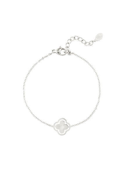 Silver double clover charm bracelet on white background with detailed chain and lobster clasp