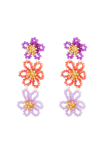 Front view of purple, orange and lavender floral beaded earrings with gold accents