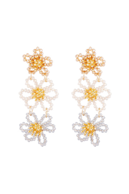 Front view of nude beige, white and silver floral beaded earrings