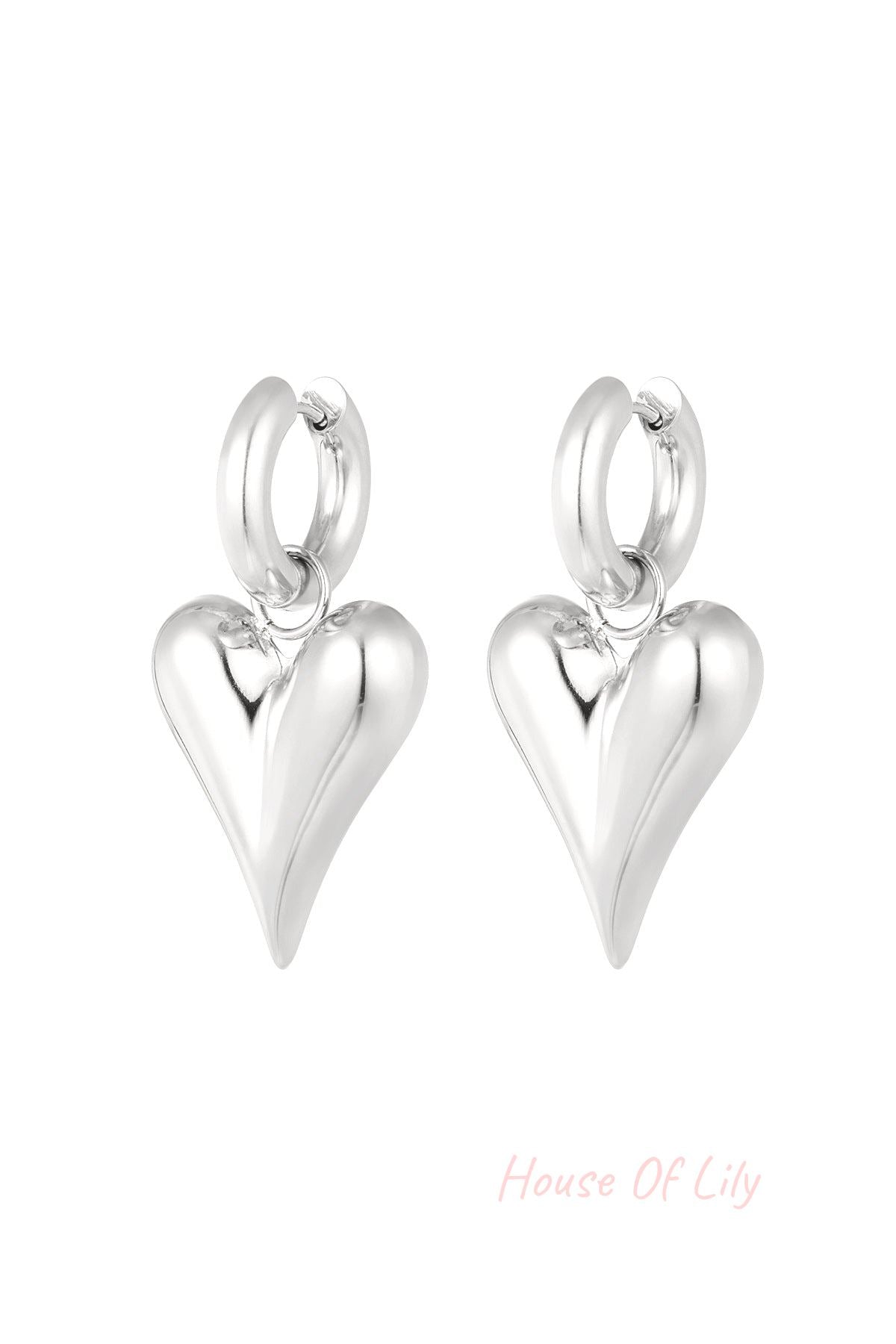Silver chunky heart hoop earrings with a smooth shiny finish on a white background