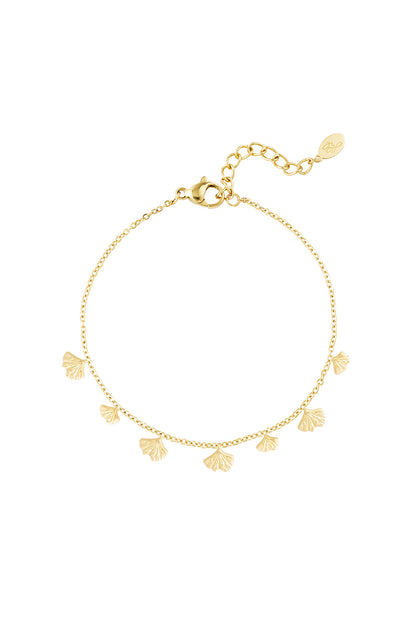 Gold charm bracelet featuring delicate ginkgo leaf charms on a fine chain with lobster clasp