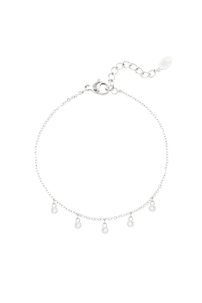 Silver disc charm bracelet with five small round sunburst-etched pendants on delicate chain with lobster clasp