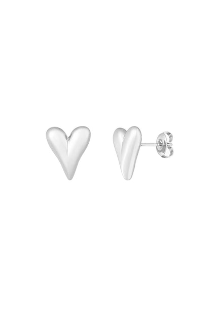 Pair of silver polished heart-shaped stud earrings with butterfly backs on white background