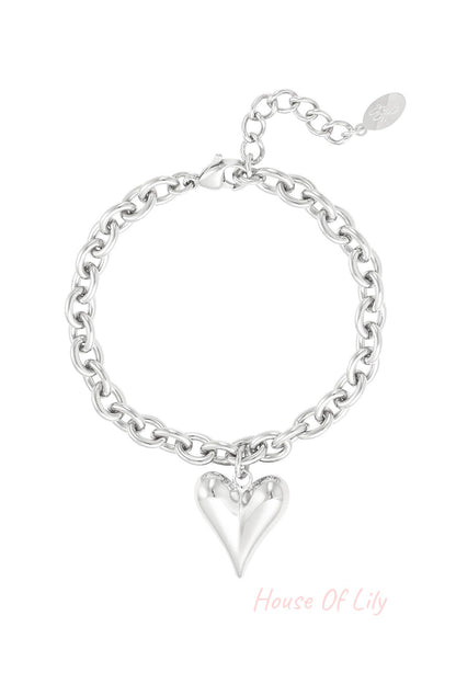 Silver chunky chain bracelet with polished heart charm and adjustable clasp on white background