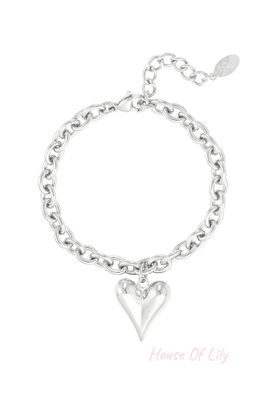 Silver chunky chain bracelet with polished heart charm and adjustable clasp on white background