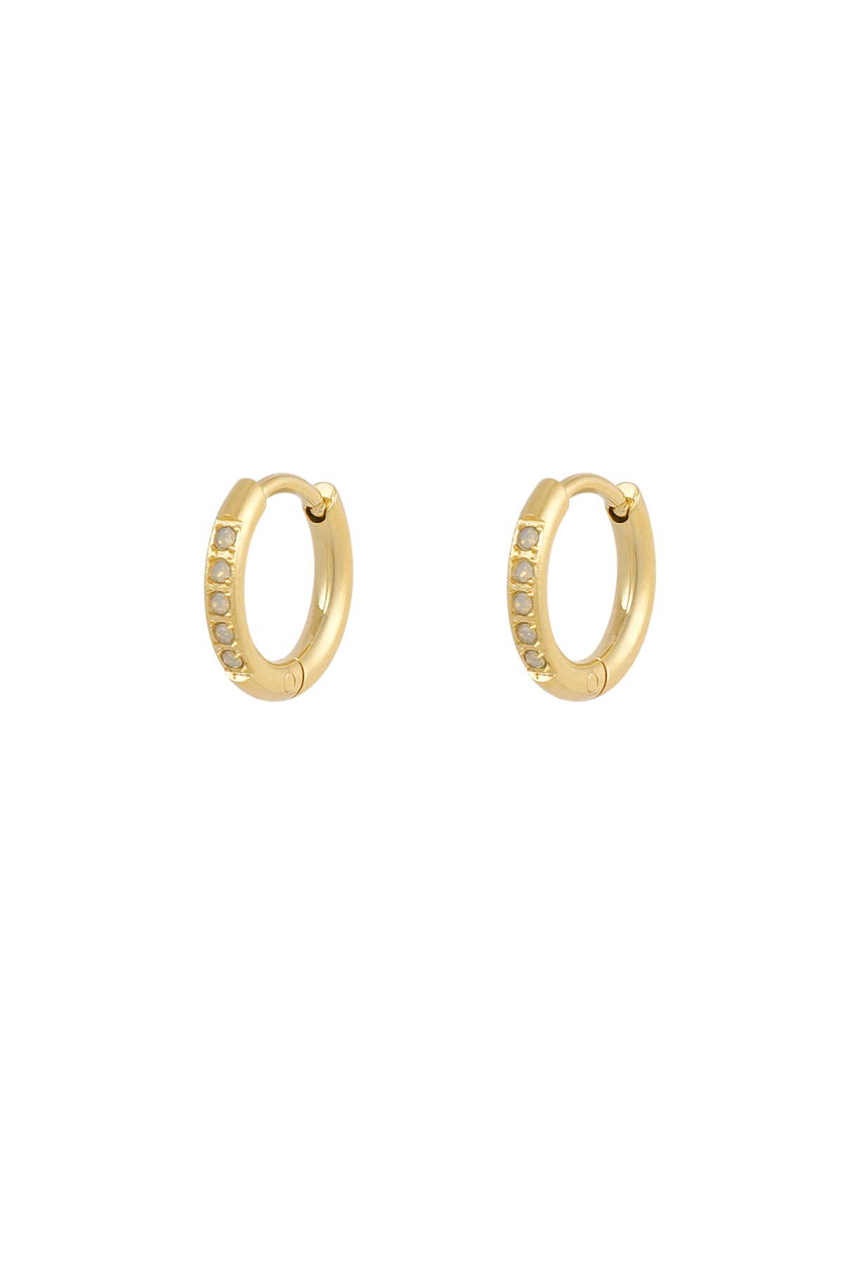 Small gold hoop earrings featuring a row of delicate, light-colored opal stones. Minimalist, elegant jewelry style.