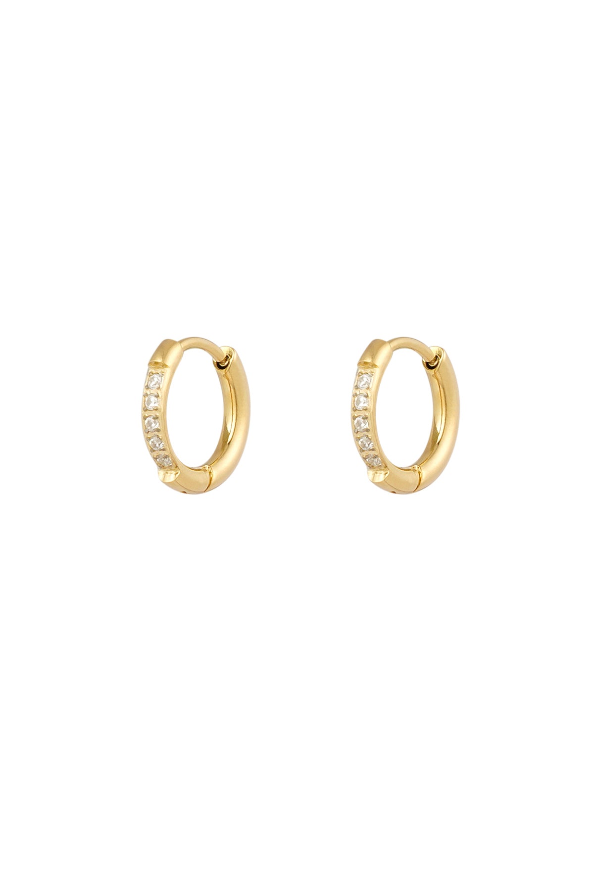 Pair of gold hoop earrings with opal-like white rhinestones on a white background