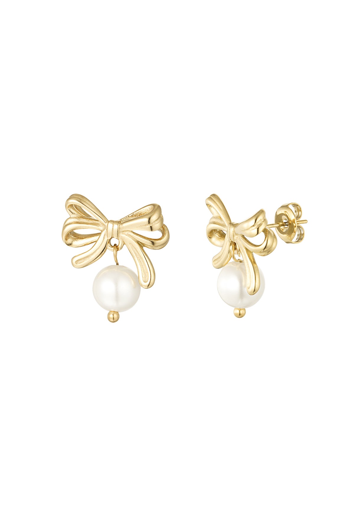 Pair of gold bow earrings with dangling white pearl drops on white background