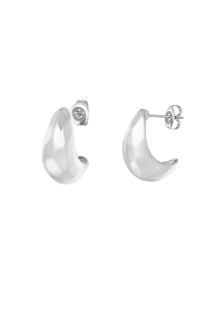 Silver organic pebble-shaped stud hoop earrings shown against white background