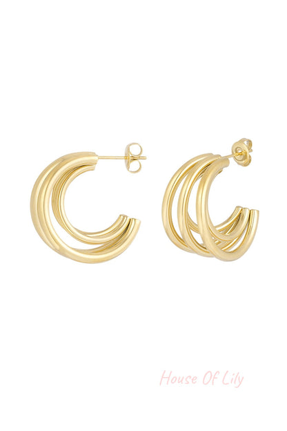 Triple loop hoop earrings in polished gold tone with post and butterfly clasp isolated on white background