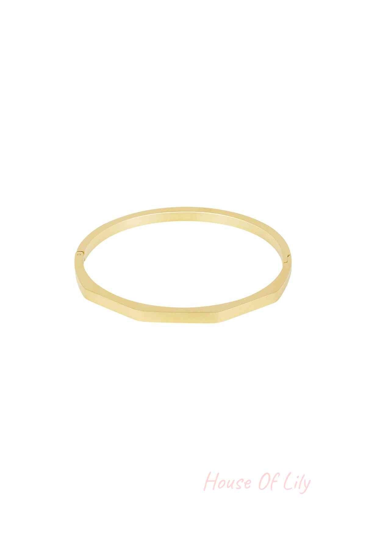 Gold hexagon-shaped bangle bracelet with a smooth matte finish on white background