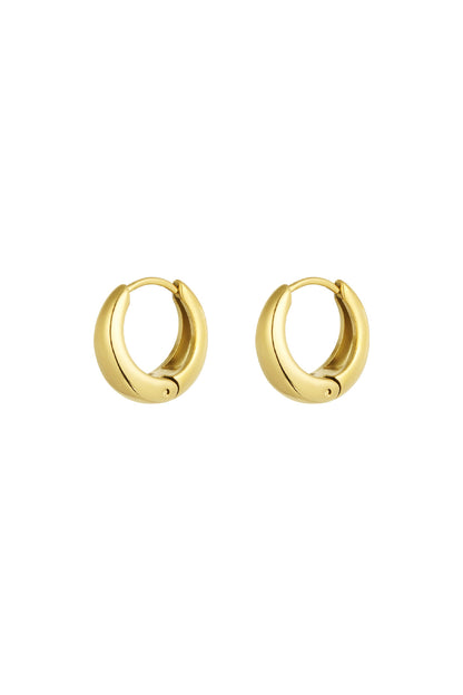 Pair of chunky gold stainless steel hoop earrings with smooth rounded edges on white background