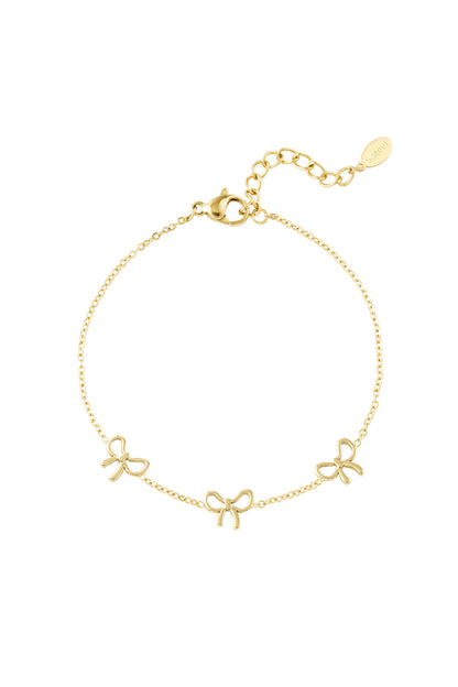 Gold-tone delicate bow charm bracelet with three bow pendants and adjustable chain clasp on white background