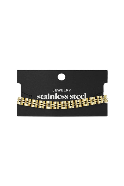 Gold double-row link chain bracelet displayed on black stainless steel jewelry card