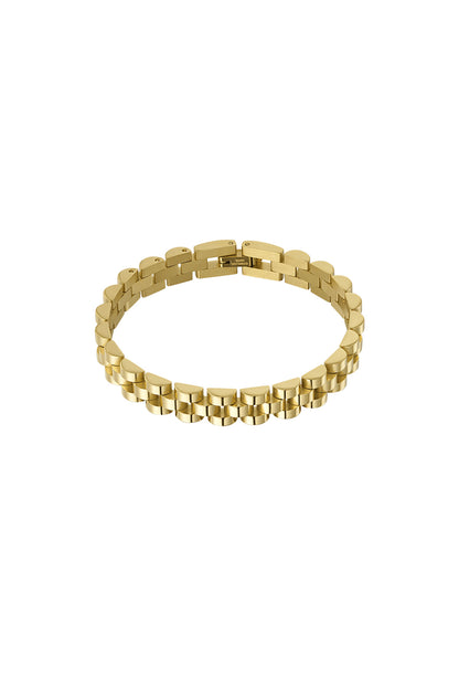 Close-up of shiny gold-tone stainless steel chain bracelet on white background