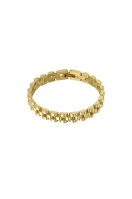 Close-up of shiny gold-tone stainless steel chain bracelet on white background