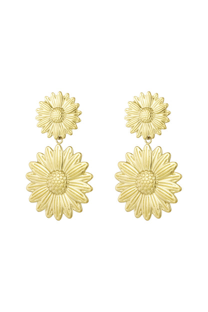 Pair of gold sunflower drop earrings with two-tier floral design on white background