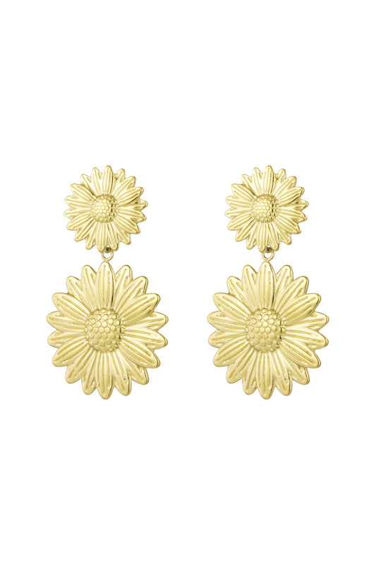 Pair of gold sunflower drop earrings with two-tier floral design on white background