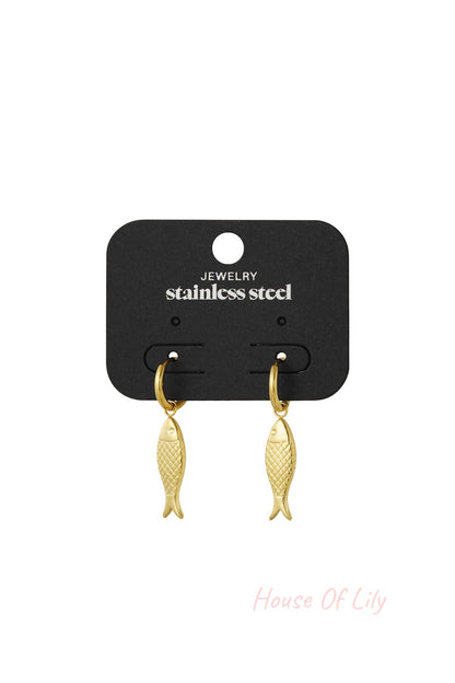 Gold fish charm earrings displayed on a black card labeled stainless steel jewellery