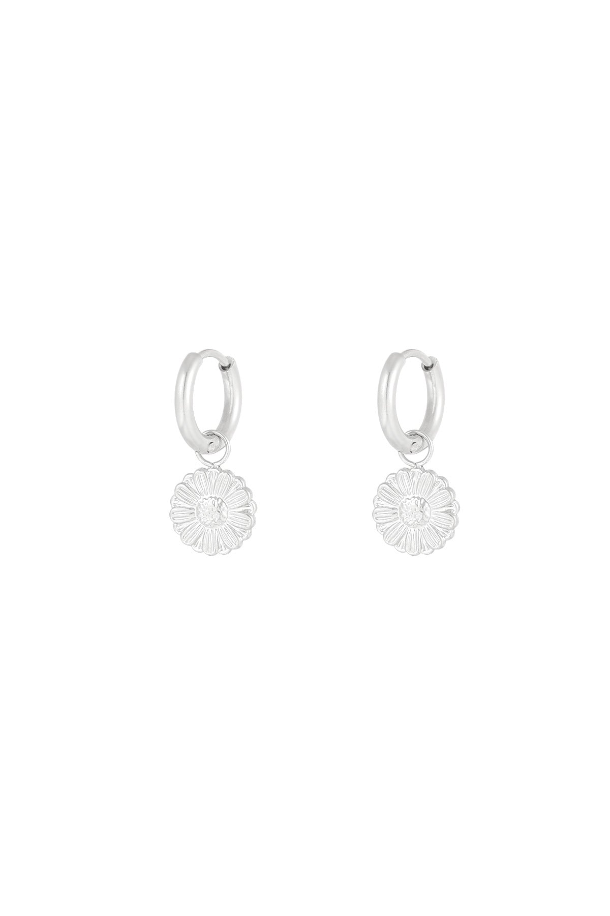 Silver hoop earrings with detailed daisy flower charms on a plain white background