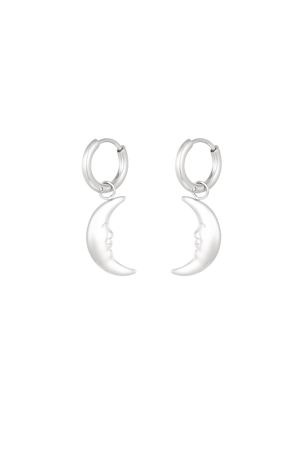 Pair of silver crescent moon face dangling hoop earrings on white background