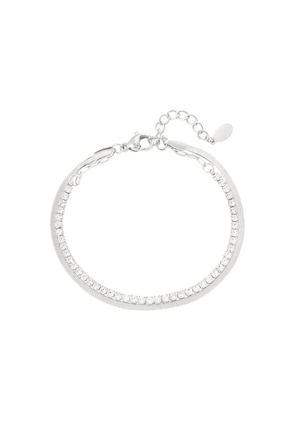Silver tone double-layer bracelet with clear crystals and polished chain on white background