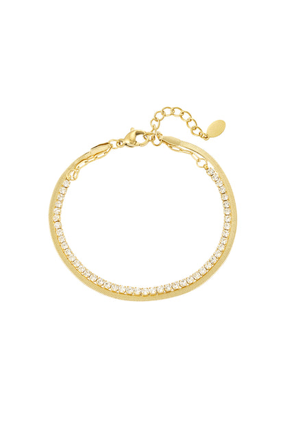 Gold tone double-layer bracelet with clear crystals and polished chain on white background
