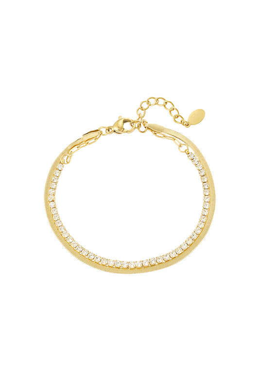Gold tone double-layer bracelet with clear crystals and polished chain on white background