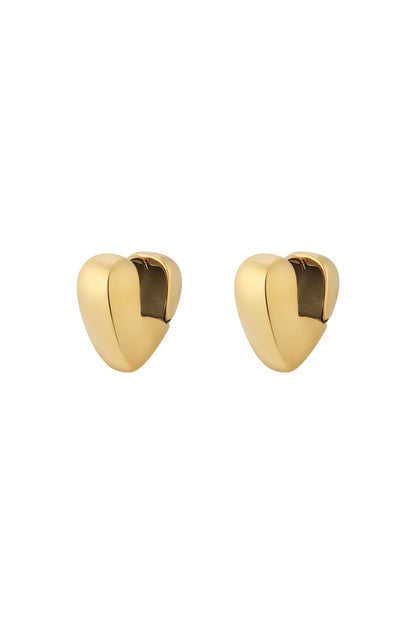 Pair of chunky gold heart-shaped hoop earrings with smooth polished finish isolated on white