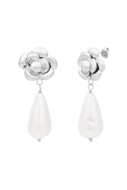 Silver rose shaped earrings with white teardrop pearl drops isolated on white background