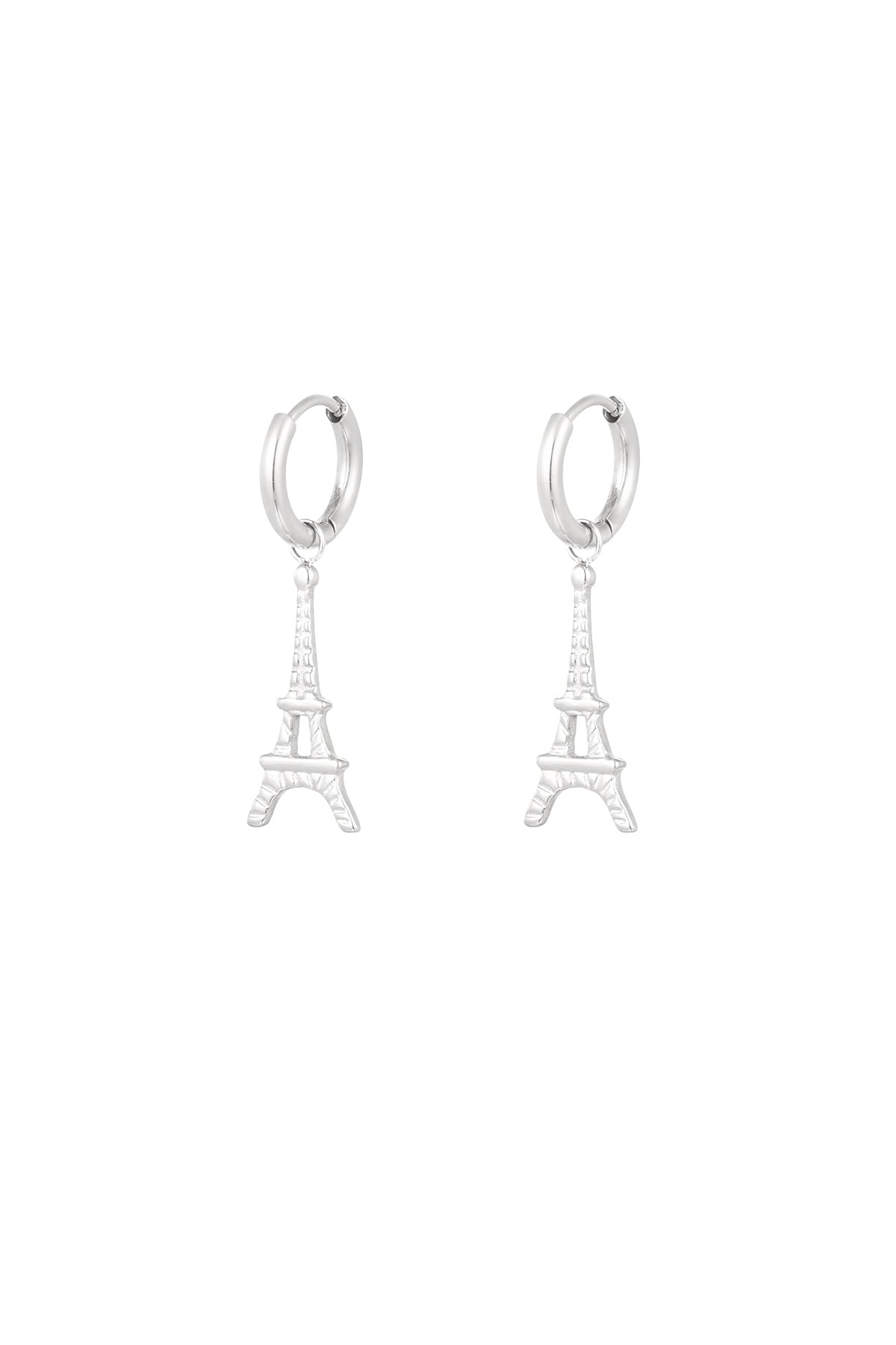 Pair of silver Eiffel Tower drop earrings on white background